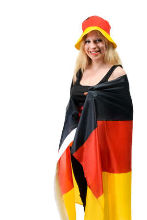 German footbal fan wrapped in flag on white backgroundの写真素材