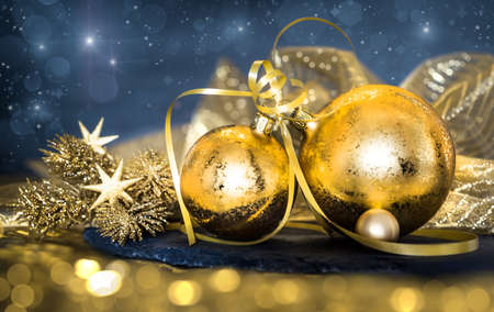 Golden Christmas decorations on dark abstract backgroundの写真素材