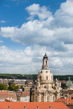 Aerial view of roofs of Old Dresden and Frauenkirche on a bright dayの写真素材