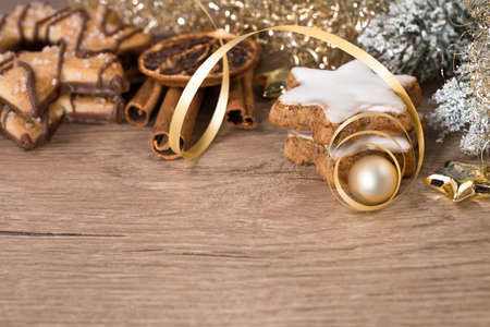 Merry Christmas! Wooden table with Christmas decorations and butter cookies. Space for your textの写真素材