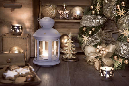 Decorative lantern, candles and Christmas decorations on vintage kitchenの写真素材