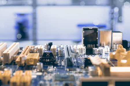 Detail of electronic board in hardware repair shop, shallod DOF, toned image, space for your textの写真素材