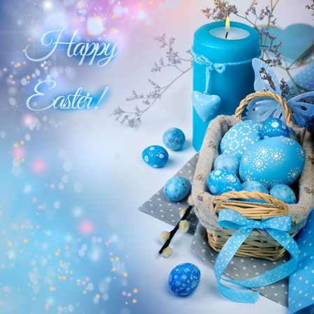 Easter composition with candle and painted eggs, toned image, abstract backgroundの写真素材