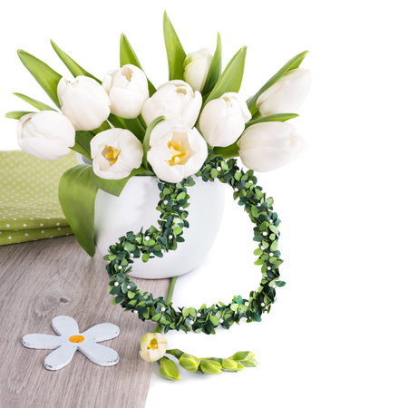 Bunch of white tulips and matching spring decorations on wood isolated on white. Can be used as corner decoration for Easter, March 8 or Motherの写真素材