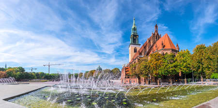 Fountains on Alexanderplatz in front of St. Mary's Church, Berlin. Panorama, focus on the church building.の写真素材