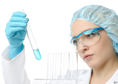 Liquid sample, chemical or biological, pipetted by a young female scientist. Shallow DOF. focus on...