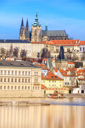 View on St. Vitus Cathedral and Prague Castle across Vltava river on a brigh Autumn dayのeditorial素材
