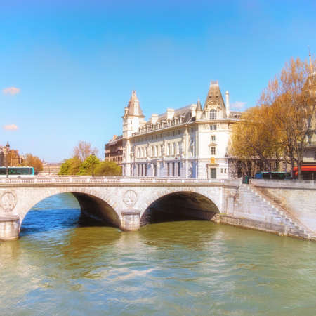 Saint-Michel bridge on Seine river in Paris, France, on a bright sunny day. This image is toned.の写真素材