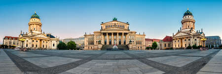 Panorama image of Gendarmenmarkt square in Berlin with French and German churches and Concert Hall at dawnの写真素材