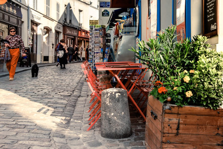 PARIS, FRANCE - APRIL 19, 2016: Tourists and locals on a quiet pedestrian area in Monmartre District. Paris is the most visited city worldwide.のeditorial素材