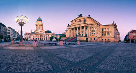 Panorama image of Gendarmenmarkt square in Berlin with German church and Concert Hall at dawnの写真素材