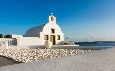 Viewing point next to local Orthodox Church in Oia, Santorini island, Greece.の写真素材