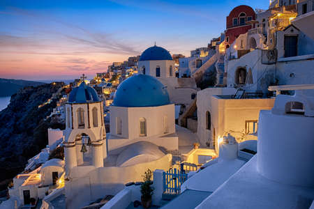 Santorini island in Greece, Oia village on a sunsetの写真素材