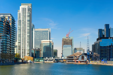 LONDON, ENGLAND - MAY 3, 2013: Canary Wharf skyline and South Dock, East London, England
