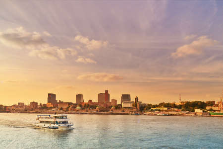 HANBURG, GERMANY- AUGUST 12, 2015: Boat with tourists goes on Elbe river in Hamburg on a sunsetのeditorial素材