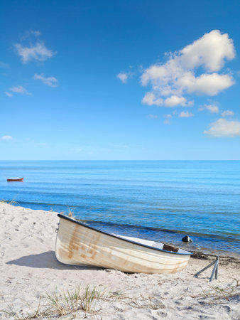 Beautiful island Rugen in Northern Germany. Fishermans boat on the sandy shore, panoramic imageの写真素材