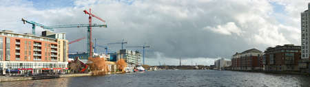 DUBLUN, IRELAND- February 4, 2017: Modern part of Dublin Docklands or Silicon Docks, construction of a new office block on a brigh morning, panoramic image taken next to Grand Canalのeditorial素材