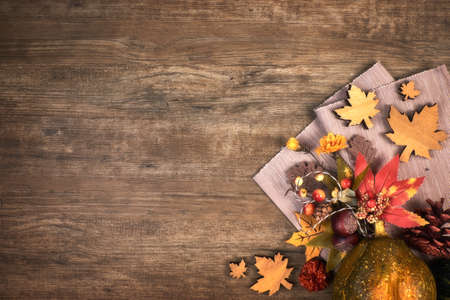 Oak wooden background with Autumn decorations in the corner, text spaceの写真素材