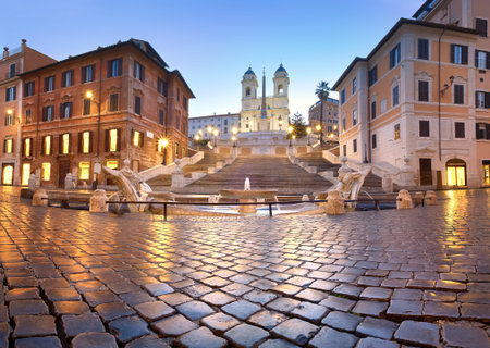 Spanish Steps and a boat-shaped fountain on Piazza di Spagna in Rome, Italy. Early morning panoramic shot after rain.の写真素材