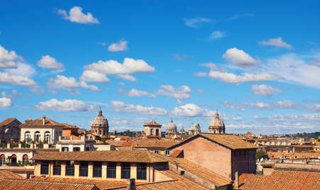 Rome, Italy, bird view to the side of Capitol Hill with roofs and churches of the ancient city on the bright dayの写真素材