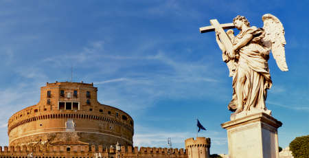 A statue of an angel on Sant Angelo Bridge in Rome, Italy, panoramic image. The bridge is leading to Castle Sant Angelo via river Tiber.のeditorial素材