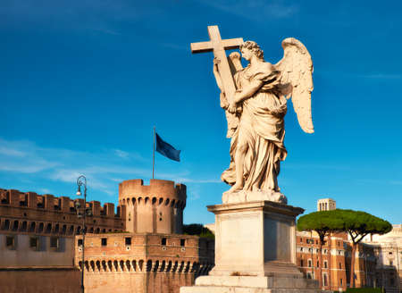 Statue of an angel on Sant Angelo Bridge in Rome, Italy, panoramic image. The bridge is leading to Castle Sant Angelo via river Tiber.のeditorial素材