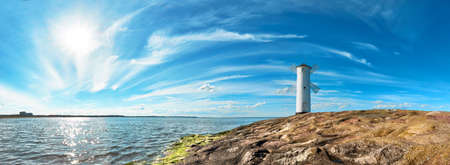 Panoramic image of a seaside by lighthouse in Swinoujscie, a port in Poland on the Baltic Sea.の写真素材