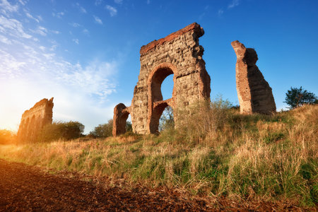 Ruins of the ancient aqueduct near Villa Quintili on Appia Way in Rome, Italy