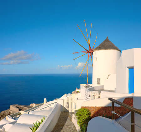 Beautiful Santorini in Greece - traditional windmill in Oia village on a sunny day. Panoramic image, square composition.の写真素材