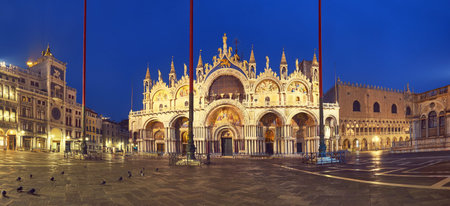 Basilica in San Marco square in Venice, Italy, at night. Panoramic image.の写真素材