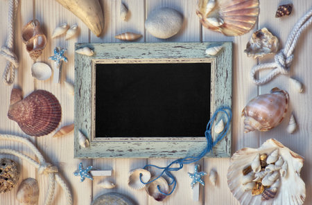 Blackboard With Maritime Decorations on light wood, toned image, text space