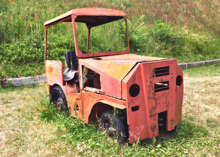 Old car, wrecked and rusty, in historic Brick factory (Ziegeleipark in German) in Mildenberg near...