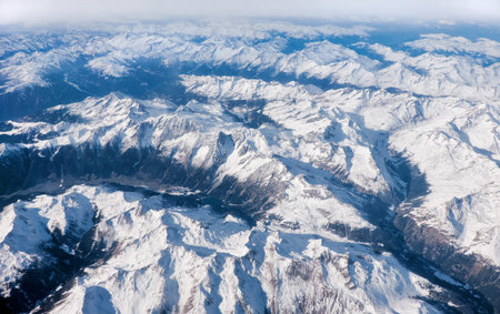 Alps under snow, aerial view from airplane