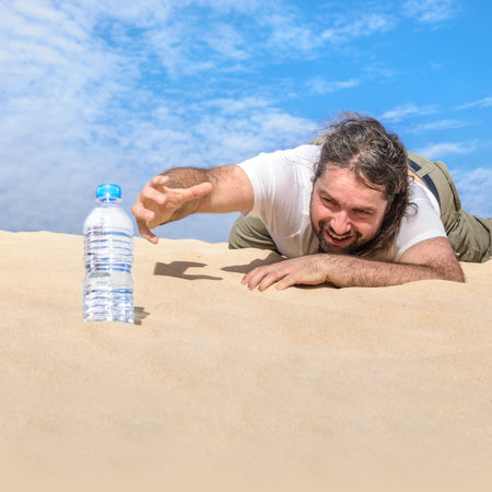 Thirsty man in the desert reaches for a bottle of pure water