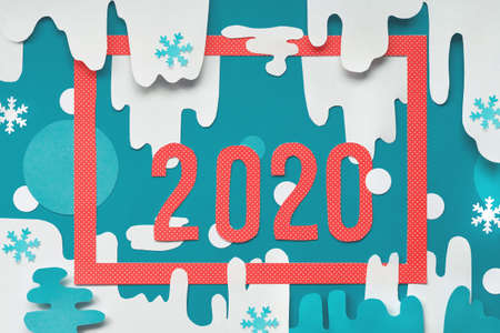 Christmas paper background in blue, red and white, top view on red frame and number 2020 on abstract winter background with snowflakesの写真素材
