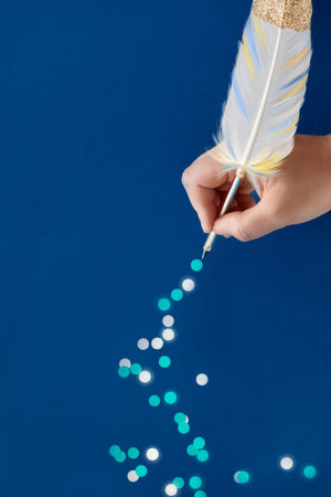 Christmas or New Year creative concept, hand drawing trail of paper snowflakes from white gilded...