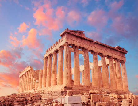 Parthenon temple on a sunset with pink and purple clouds. Acropolis in Athens, Greeceの写真素材
