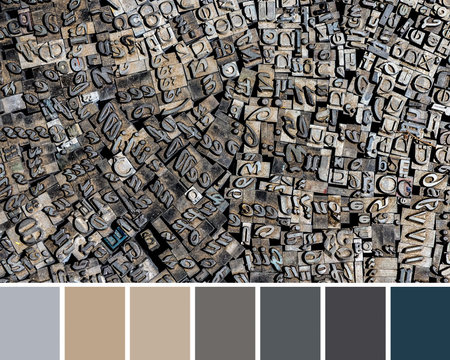 Trendy color matching palette from flat lay of many old letterpress German letters used for printing