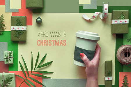 Eco friendly zero waste products wrapped as Christmas or New Year gifts without plastic. Creative flat lay, top view of zero waste Christmas gift ideas, multicolor geometric paper background.の写真素材