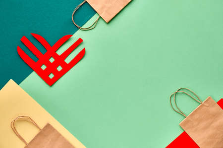 Creative paper lay, top view on the concept of Giving Tuesday. Geometric paper flat layout, paper stripe heart, copy-space. Givingtuesday is a global generosity campaign to give away unwanted things.のeditorial素材