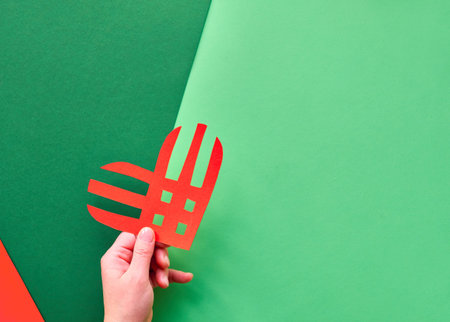 Creative paper lay, top view on the concept of Giving Tuesday. Geometric paper flat layout, paper...