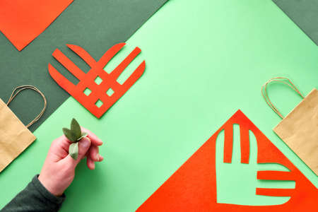 Creative paper lay, top view on the concept of Giving Tuesday. Geometric paper flat layout, paper stripe heart, copy-space. Givingtuesday is a global generosity campaign to give away unwanted things.のeditorial素材