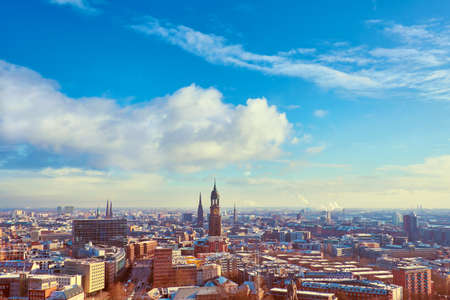 Scenic panorama view from Dancing Towers over Hamburg under snow in winter with St. Michael's Church (German: St. Michaelis), Speicherstadt, river Elbe and New Philharmonic Theater, Elbphilharmony.のeditorial素材