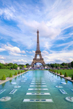 Symmetrical front panoramic view of Eiffel tower on a bright Summer day taken from fountains of Trocadero.の写真素材