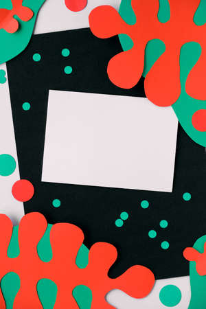 Abstract organic shapes, paper art. Fluid curving forms in red, green on black white background with dots, paper confetti. Matisse cutting inspired background. Copy-space, place for text.の写真素材