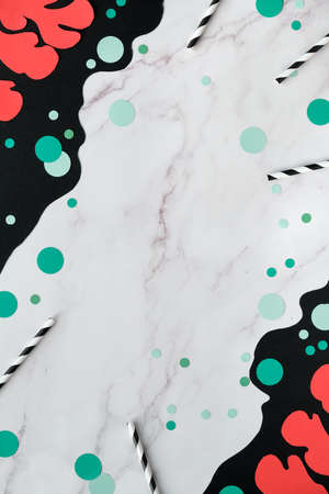 Abstract organic shapes, paper art. Fluid curving forms in red, green, black on marble background with dots, paper confetti. Matisse cutting inspired collage arrangement.の写真素材