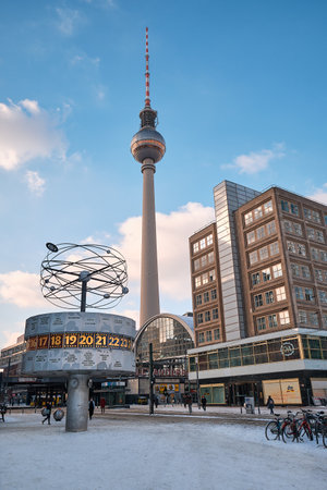 BERLIN, GERMANY FEBRUARY 10, 2021: Berlin under snow. Alexanderplatz with famous TV tower, World Clock and train station covered with snow.のeditorial素材