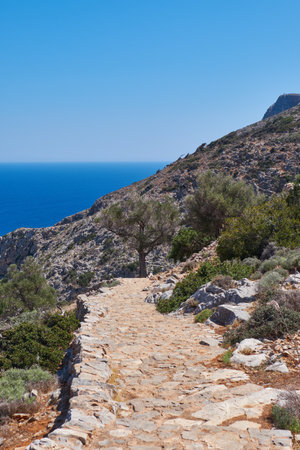Stone walkway, pathway at the cliffs of the Mediterranean seaの写真素材