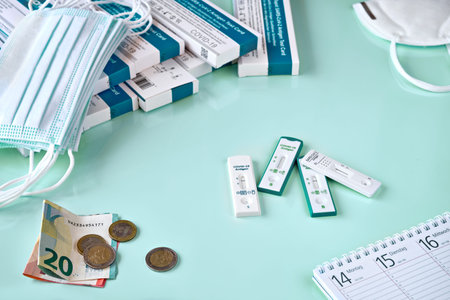 Cost of shnelltest, express corona test in German language. Shopping cart with covid 19 antigen...