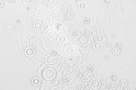 Water background. White water texture, blue mint water surface with rings and ripple. Spa concept background. Flat lay, top view, copy space, copy-space.の写真素材